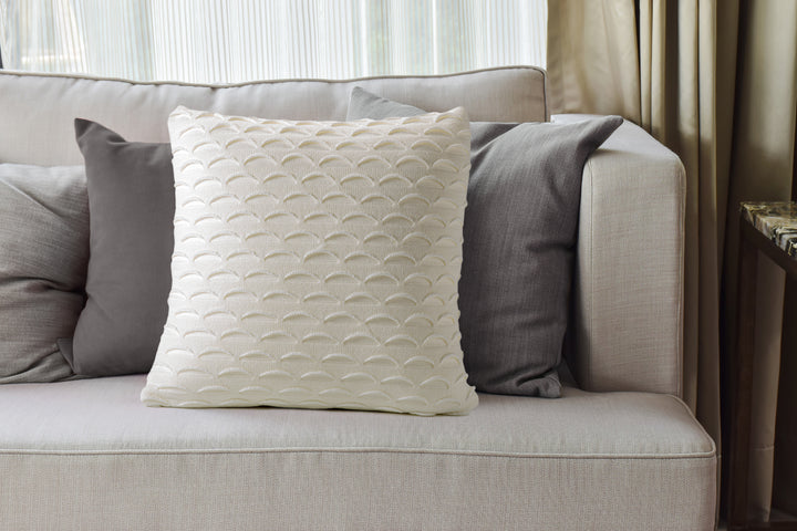 Coussin décoratif en tricot à motif crème