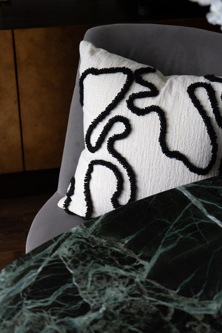 Chenille pillow with black embroidery