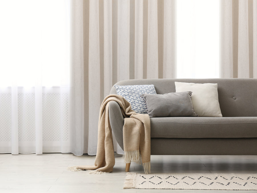 Burano semi sheer herringbone jacquard grommet curtain in linen, styled at a window