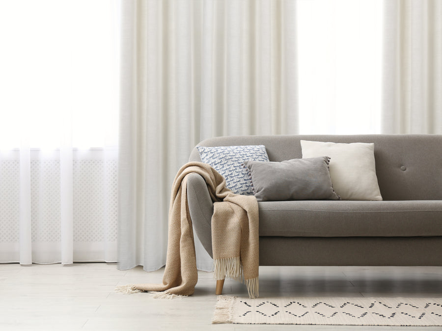 Corsica light filtering natural look jacquard curtain, styled at a window