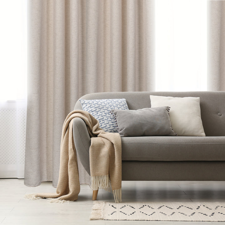 Girona taupe textured jacquard curtain, styled at a window