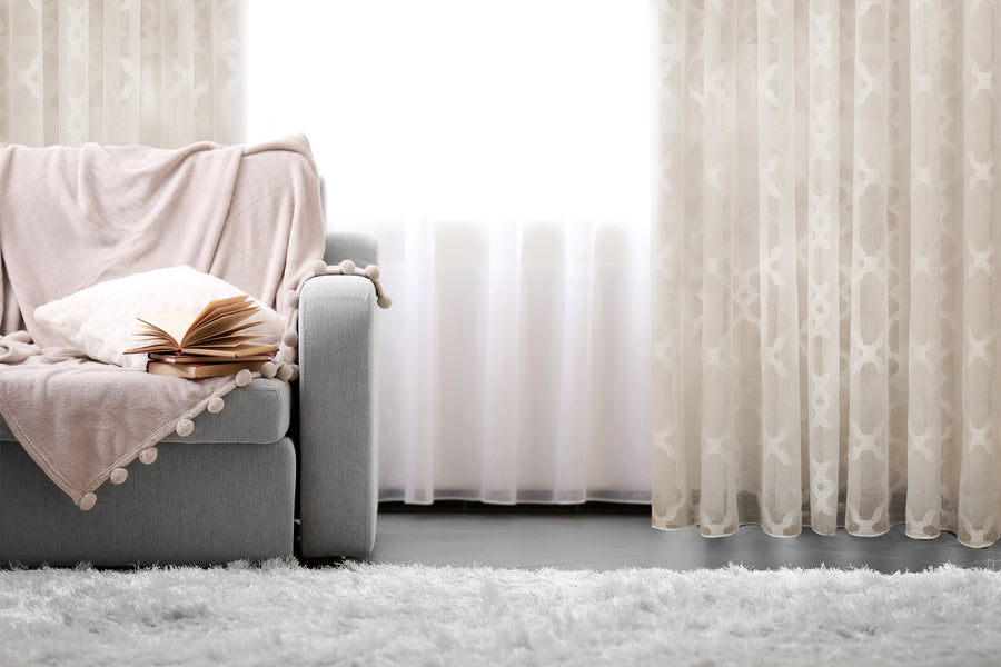 Modena retro jacquard design sheer grommet curtain in linen, styled at a window