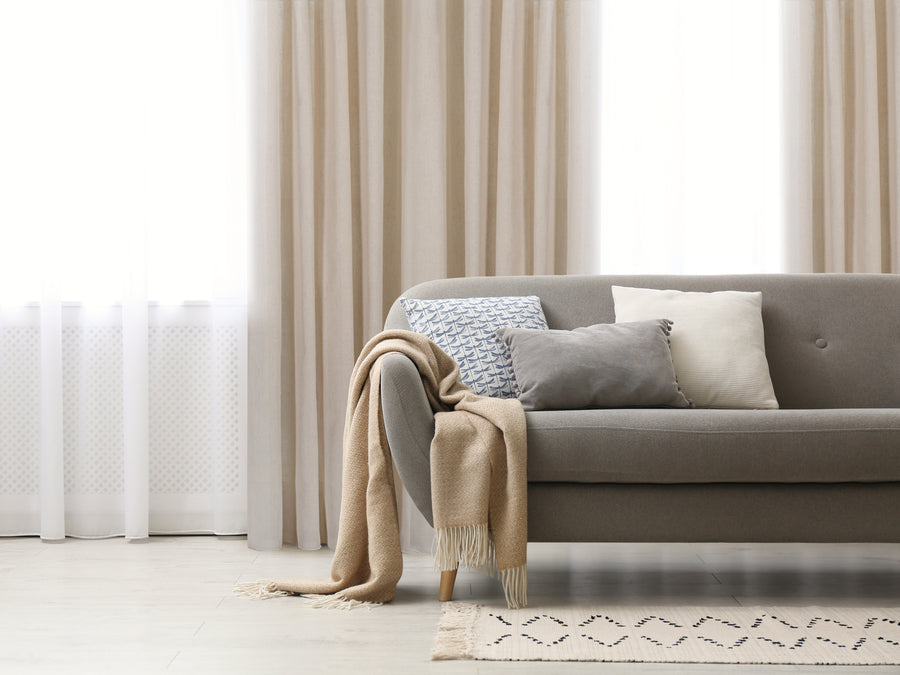 Orvieto jacquard curtain in beige, styled at a window