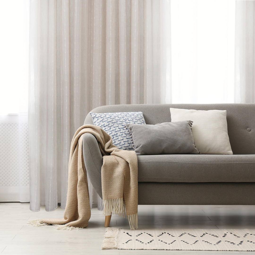 Palma taupe sheer jacquard design curtain, styled at a window