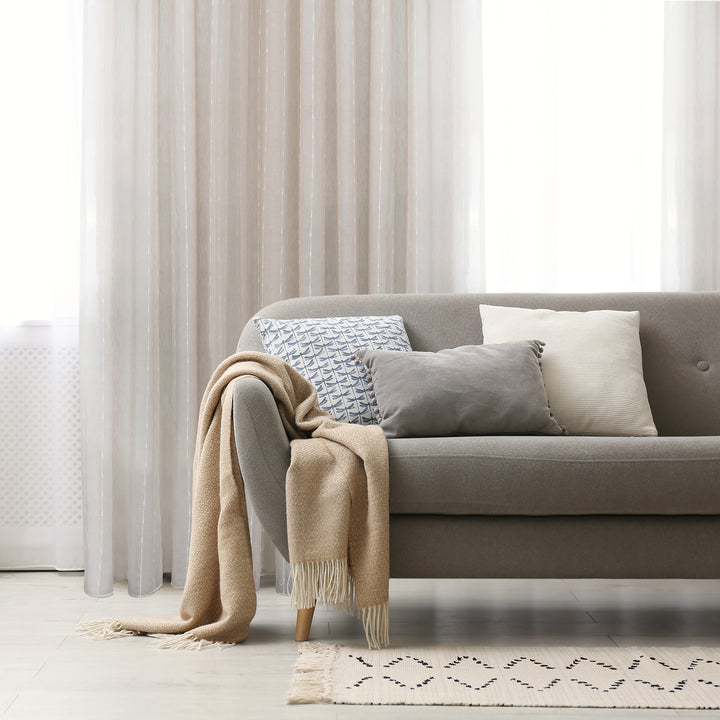 Palma taupe sheer jacquard design curtain, styled at a window