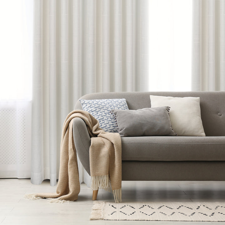 Pasha jacquard curtain in natural, styled at a window
