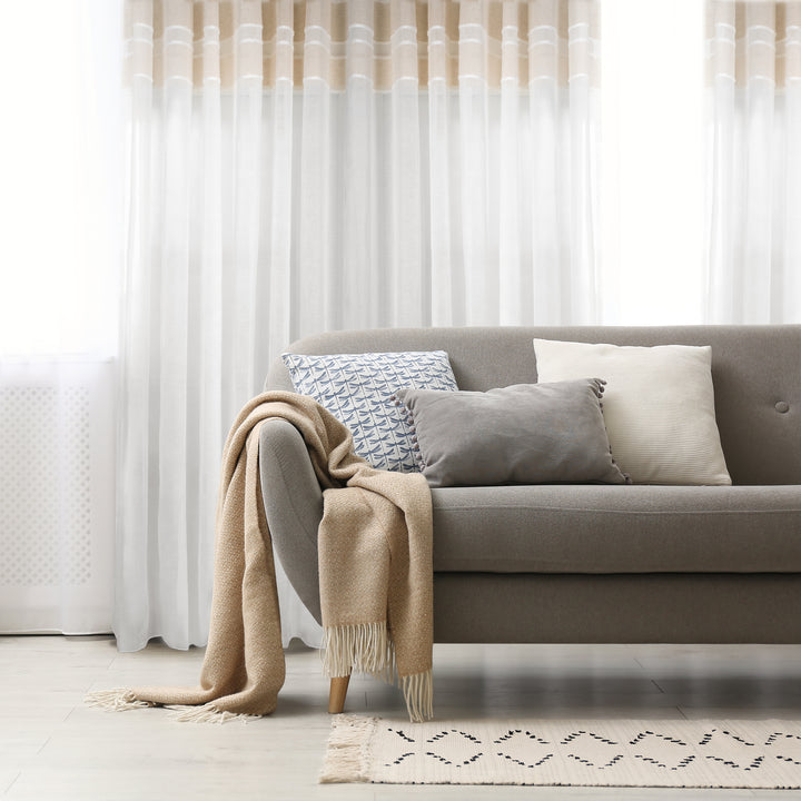 Galicia linen jacquard curtain in beige, styled at a window