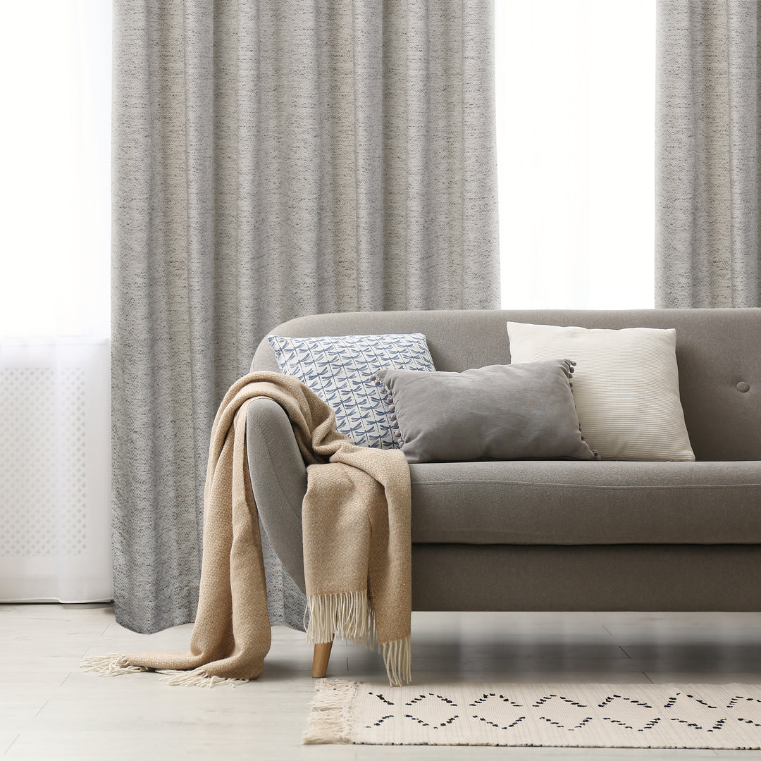 Tirana grey jacquard curtain, styled at a window