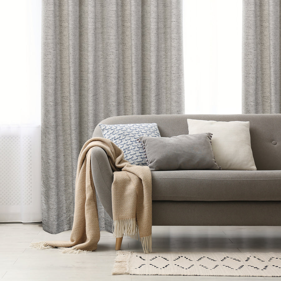 Tirana grey jacquard curtain, styled at a window