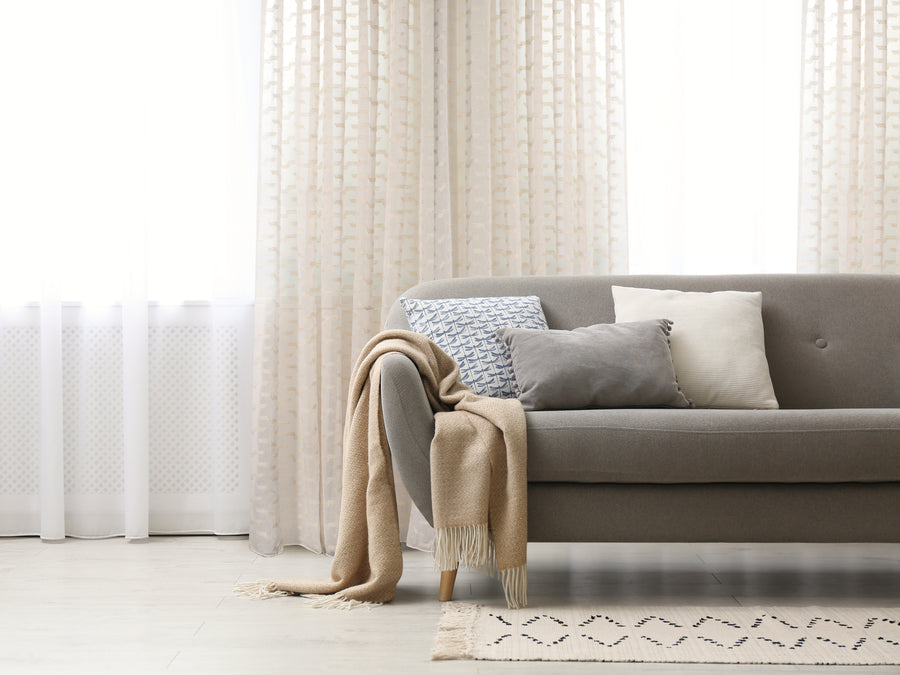 Via rustic inspired wide width sheer curtain in linen, styled at a window