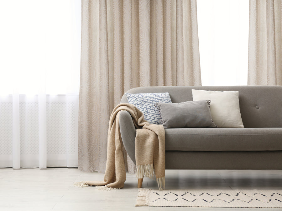 Zacari woven leaf design textured semi sheer curtain in camel, styled at a window