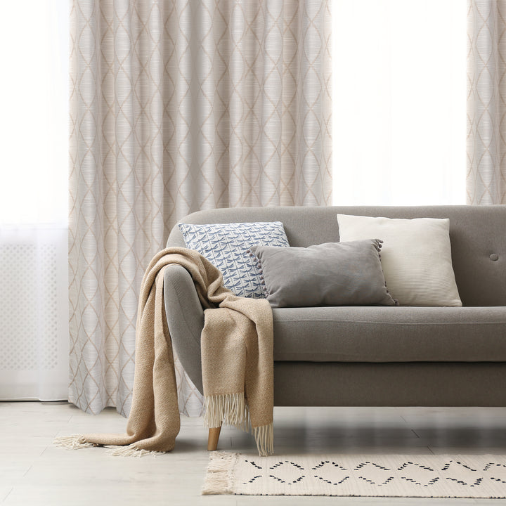 Zurrich textured jacquard curtain in beige, styled at a window